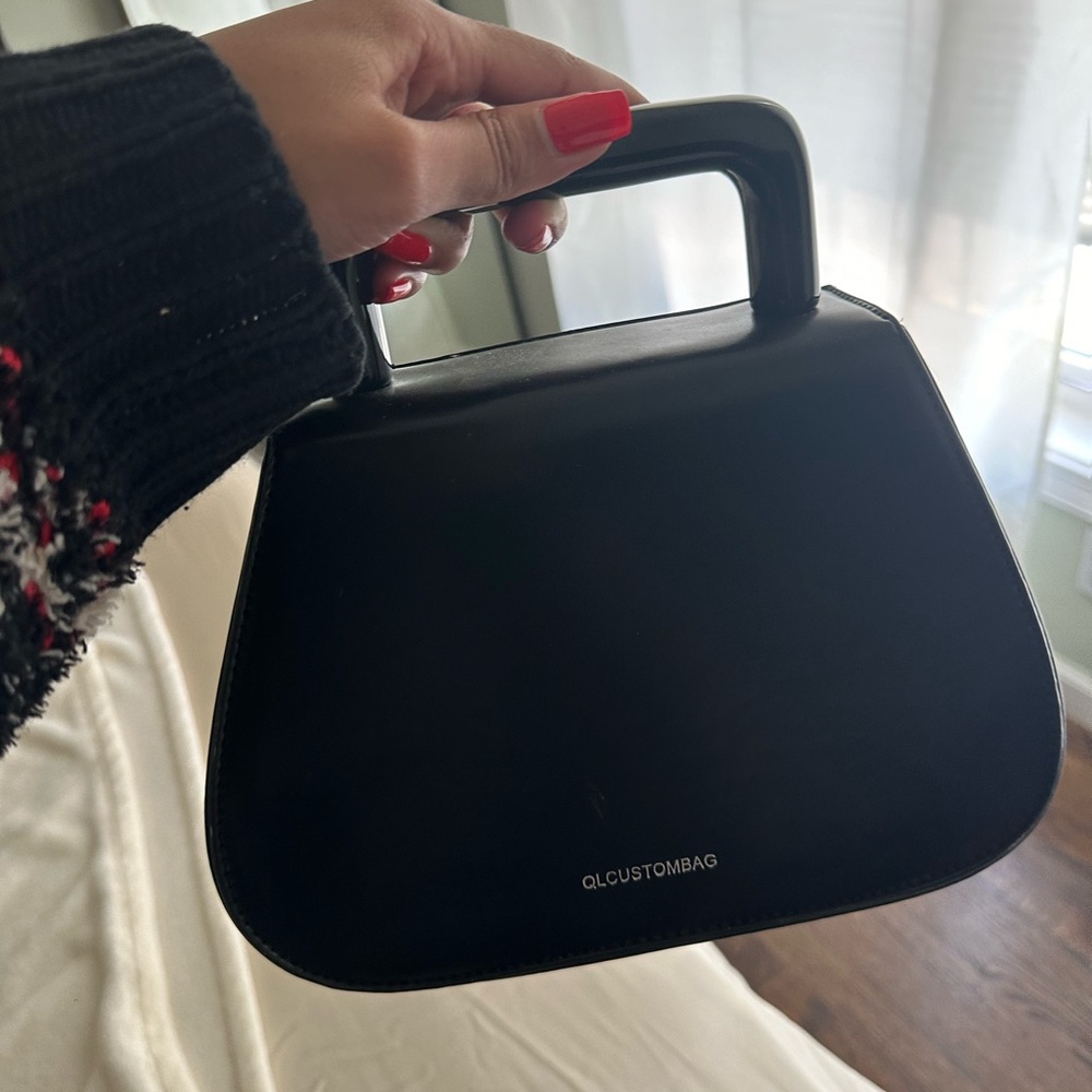 Black handbag purchased from boutique a while ago